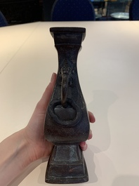 A Chinese archaistic bronze vase and three Japanese bronze vases, 14/18th C.