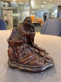 A fine Chinese carved bamboo group with Liuhai on wooden stand, 19th C.