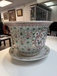 A pair of large Chinese famille rose 'dragon and phoenix' jardini&egrave;res and stands, 20th C.
