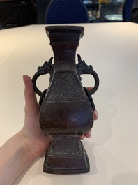 A Chinese archaistic bronze vase and three Japanese bronze vases, 14/18th C.