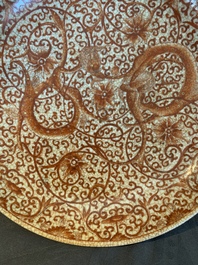 A Chinese iron-red-decorated crackle-glazed  'chilong and lotus scroll' plate, Jiajing mark, 19th C.