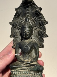 A Khmer bronze figure of Buddha Mucilinda, Angkor period, 12/13th C.