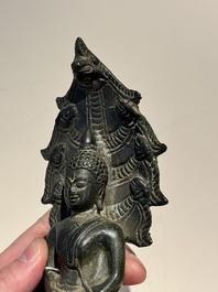 A Khmer bronze figure of Buddha Mucilinda, Angkor period, 12/13th C.