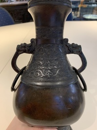 A Chinese archaistic bronze vase and three Japanese bronze vases, 14/18th C.