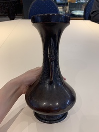 A Chinese archaistic bronze vase and three Japanese bronze vases, 14/18th C.
