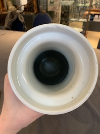 A Chinese blue and white 'flower scrolls' rouleau vase, Kangxi