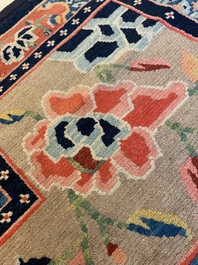 Two Tibetan saddle rugs with floral design, 19th C.