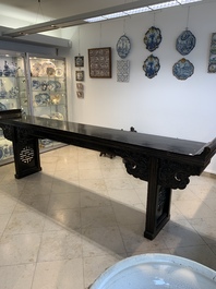 A massive Chinese red-and-black-lacquered altar table, 'qiaotouan', Qing