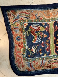 Two Tibetan saddle rugs with dragons and phoenixes, 19th C.