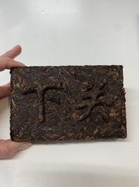 Seven Chinese Pu'er tea and black tea bricks, 20th C.