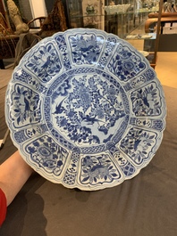 A large Chinese blue and white 'kraak' dish with birds among flowering branches, Wanli