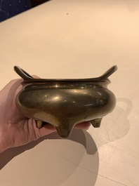 A Chinese bronze tripod censer with two handles, Xuande mark, 19th C.