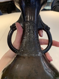 A Chinese archaistic bronze vase and three Japanese bronze vases, 14/18th C.