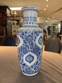 A Chinese blue and white 'flower scrolls' rouleau vase, Kangxi