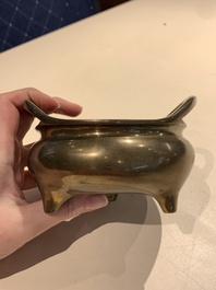 A Chinese bronze tripod censer with two handles, Xuande mark, 19th C.