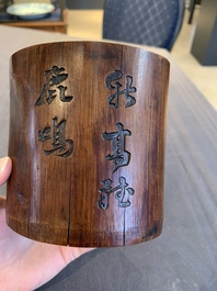 Two Chinese carved bamboo brush pots and an ink stone with wooden cover and stand, signed He Xuanting 何選廷 and Dian Liangbi 典良弼, 19th C.