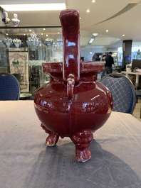A Chinese flamb&eacute;-glazed tripod censer with 'ruyi' handles, 19th C.