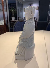 A Chinese Dehua blanc de Chine figure of Wenchang, 20th C.