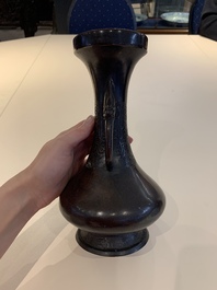 A Chinese archaistic bronze vase and three Japanese bronze vases, 14/18th C.