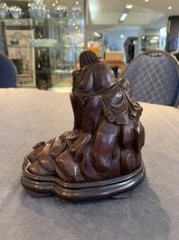 A fine Chinese carved bamboo group with Liuhai on wooden stand, 19th C.