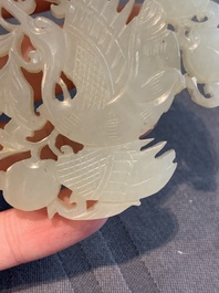 Two Chinese white and celadon jade 'crane' and 'deity' plaques, Qing