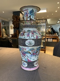 A pair of Chinese Nanking famille rose vases with narrative design, 19th C.
