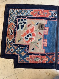 Two Tibetan saddle rugs with floral design, 19th C.