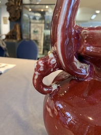 A Chinese flamb&eacute;-glazed tripod censer with 'ruyi' handles, 19th C.