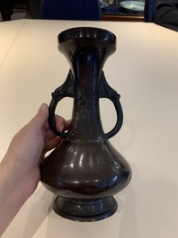 A Chinese archaistic bronze vase and three Japanese bronze vases, 14/18th C.