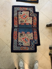 Two Tibetan saddle rugs with floral design, 19th C.