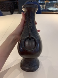A Chinese archaistic bronze vase and three Japanese bronze vases, 14/18th C.