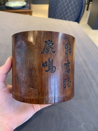 Two Chinese carved bamboo brush pots and an ink stone with wooden cover and stand, signed He Xuanting 何選廷 and Dian Liangbi 典良弼, 19th C.
