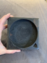 Two Chinese carved bamboo brush pots and an ink stone with wooden cover and stand, signed He Xuanting 何選廷 and Dian Liangbi 典良弼, 19th C.