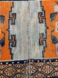 Two Tibetan saddle rugs with floral design, 19th C.