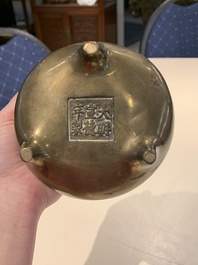 A Chinese bronze tripod censer with two handles, Xuande mark, 19th C.