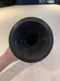 A Chinese archaistic bronze vase and three Japanese bronze vases, 14/18th C.