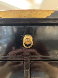 A rare Japanese black-lacquered cabinet with finely engraved gilt mounts, Edo, late 17th C.