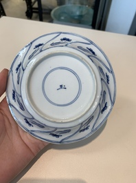18 Chinese blue and white cups and 16 saucers with floral design, jade mark, Kangxi