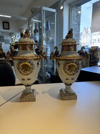 A pair of Chinese export famille rose urns and covers, Qianlong