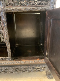 A richly carved Chinese hongmu display cabinet, Canton, 19th C.