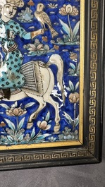 A rectangular Qajar relief-moulded tile with a prince on horseback, Iran, 19th C.