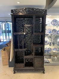 A richly carved Chinese hongmu display cabinet, Canton, 19th C.