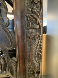 A richly carved Chinese hongmu display cabinet, Canton, 19th C.