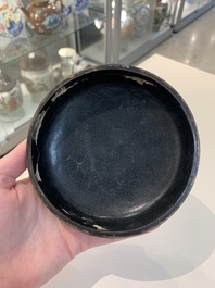 Two Chinese snuff bottles, four soapstone seals and a lacquer covered box, 20th C.