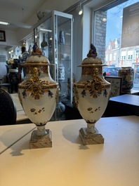 A pair of Chinese export famille rose urns and covers, Qianlong