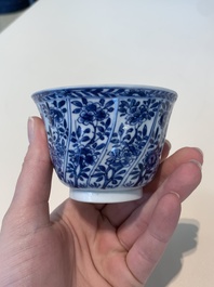 18 Chinese blue and white cups and 16 saucers with floral design, jade mark, Kangxi