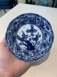 18 Chinese blue and white cups and 16 saucers with floral design, jade mark, Kangxi