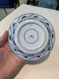 18 Chinese blue and white cups and 16 saucers with floral design, jade mark, Kangxi