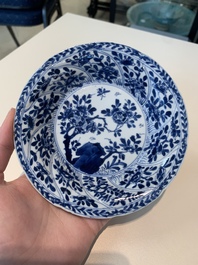 18 Chinese blue and white cups and 16 saucers with floral design, jade mark, Kangxi