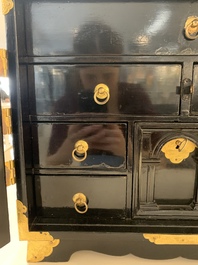 A rare Japanese black-lacquered cabinet with finely engraved gilt mounts, Edo, late 17th C.